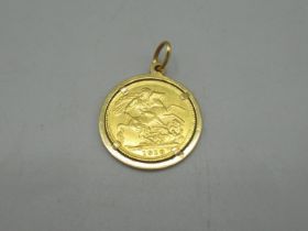 Geo.V 1918 sovereign in yellow metal mount, 10.1g