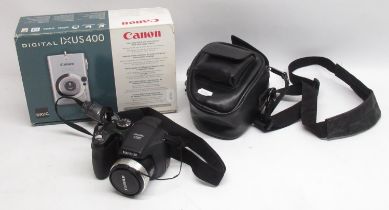 Boxed Canon Ixus 400 4.0M pixel digital camera and a Fujifilm FinePix S5700 7.1 mega pixel digital