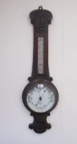 I Henri London - C20th carved oak aneroid wheel barometer with thermometer, H90.5cm
