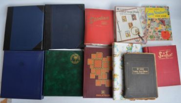 Collection of 11 stamp albums incl. Cocos (Keeling) Islands album, 2 Maritime Heritage albums (