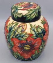 Moorcroft Pottery: ginger jar and cover, decorated with red flowers on a cream ground, dated 2000,