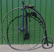 Penny Farthing or Ordinary Bicycle, the brown leather seat on later painted tubular frame, the