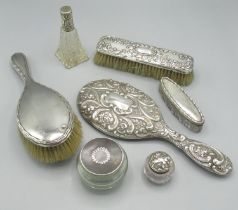 Collection of post 1900 hallmarked silver dressing table items incl. two brushes, a hand mirror,
