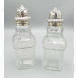 Early C19th pair of pressed glass pepperettes with silver tops H14cm