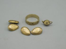 9ct gold ring with Celtic style decoration, size V, a 9ct miniature teapot and a pair of 9ct gold