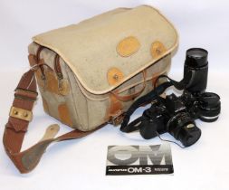 Olympus OM-3 SLR camera body, three HOYA lenses, camera bag
