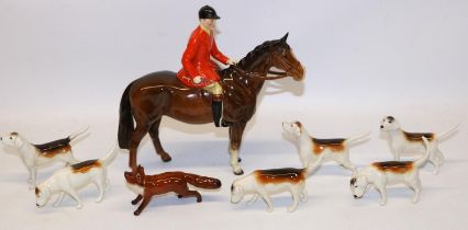Beswick Huntsman on bay/brown horse No. 1501, fox No. 1440 with black tipped tail, and six foxhounds
