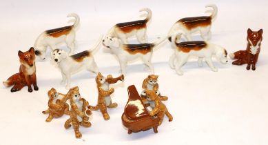 Two Beswick seated foxes No. 1748; six Beswick foxhounds; and five unmarked cat figures with musical
