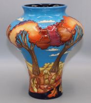 Moorcroft Pottery: vase decorated with stylised trees against a blue sky, dated 2002, initialed