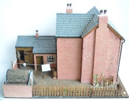 Large charming home made wooden wartime house model with Anderson shelter. Includes removeable