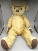 Large Mid 1930's teddy bear in blonde mohair, possibly Merrythought, with repairs to pads, eyes
