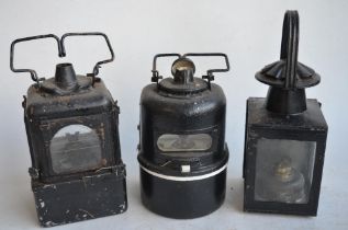 Three vintage railway lamps to include BR(M) half round lamp by Lamp Manufacturing & Railway