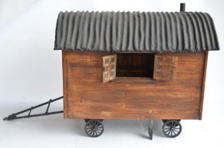 Large homemade wooden shepherds hut model with removeable roof to reveal detailed interior