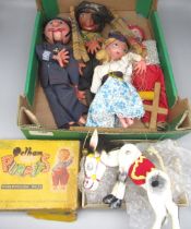 Five Pelham puppets including policeman, pirate, horse etc.