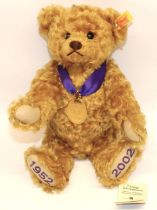 Steiff teddy bear: Golden Jubilee (1952-2002) 660740, golden mohair, with purple ribbon and