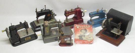 Collection of four Vulcan mini-sewing machines, a Comet mini-sewing machine, Baby mini-sewing