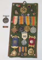 Framed collection of Medals and badges, set of medals to 55074 Cpl J. Butcher R.E. 1914 Star,