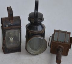 Two vintage railway lamps to include a BR(M) railwayman's lamp with slatted red, green and blue