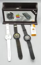 Apple Mac 'OS' face quartz analogue wristwatch and 2 other Apple quartz wristwatch, iPhone 3G desk