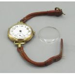 Swiss - gold trench wristwatch, white enamel Arabic dial with skeletonised numerals and subsidiary
