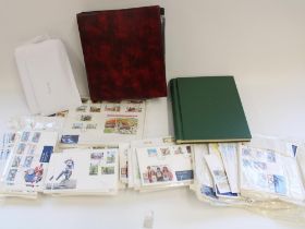 Collection of Isle of Man FDCs together with an all world stamp album