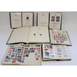 Four GB and world stamp albums together with a Harrington and Byrne issue 1953 UNM 1953 Coronation