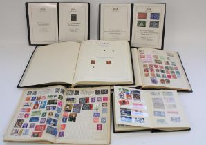 Four GB and world stamp albums together with a Harrington and Byrne issue 1953 UNM 1953 Coronation