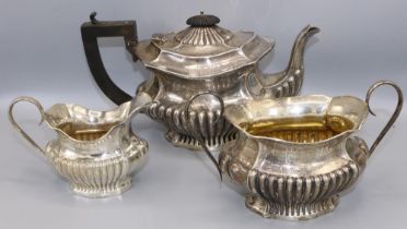 Georgian style three-piece silver tea service by Joseph Gloster, Birmingham, 1910, gross 29 ozt. (3)