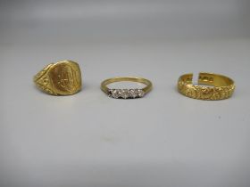 18ct yellow gold four stone diamond ring (A/F), size R, and two more 18ct gold rings, both A/F, 12.