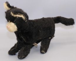 Mid C20th clockwork jumping cat, black and white mohair, H17cm, with tag 'Made in Republic of