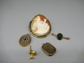 Two yellow metal Edwardian locket pendants, and a yellow metal mounted cameo brooch, scarab pin
