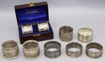 Group of nine variously hallmarked C20th silver napkin rings, incl. a set of two cased napkin