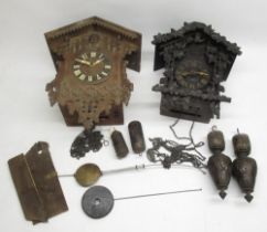 Early C20th Black Forest cuckoo clock with applied rustic carved decoration and weight driven