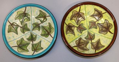 Moorcroft Pottery: two ivy pattern pin dishes - one with blue rim, and the other with brown rim,