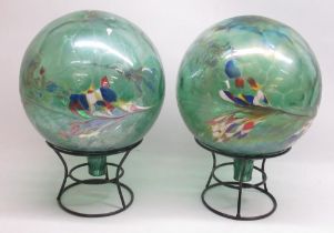 Pair of glass garden globes on metal stands, approx. H39cm