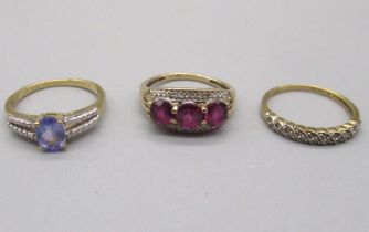 9ct yellow gold ring set with garnet and diamond, stamped 375, size O, a 10ct gold ring set with