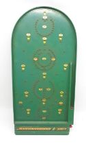 Green Chad Valley bagatelle board, H77.5cm x W37.5cm with 5 metal balls