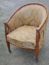 An early C20th mahogany framed tub chair in square tapering legs