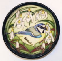 Moorcroft Pottery: 'Blue Tit's Bounty' design pin dish, bird with snowdrops on dark blue ground,