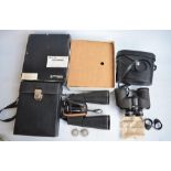 A pair of Bresser Saturn 20x60 binoculars with case and original shipping box and a pair of Chinon