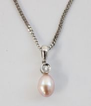 18ct white gold necklace, the pendant formed of an egg shaped pearl below small diamond, 5.6g