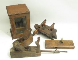 Early C20th oak smokers cabinet with glazed door, late C19th carpenters plane, three similar