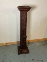 Victorian oak square tapering pedestal, relief carved with trailing leafage and figures, on