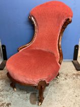 Victorian walnut framed upholstered nursing chair, on moulded cabriole legs and casters, H90cm