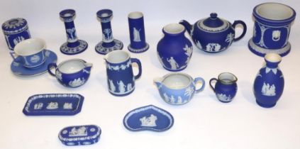 Collection of Wedgwood dipped blue jasperware, incl. teapot, pair of candlesticks, four jugs, cup