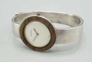 Jean Renet ladies silver wristwatch, inset hardwood bezel on integral hinged bracelet hallmarked .