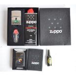 Three boxed Zippo lighters to include a Guinness Toucan (personalised to rear), tortoise gift pack