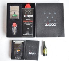 Three boxed Zippo lighters to include a Guinness Toucan (personalised to rear), tortoise gift pack