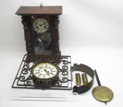 Early C20th double weight Vienna wall clock movement in later wrought iron case and another wall