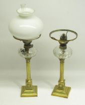 Pair of Late 19th/Early 20th century brass column oil lamps, 1 missing flume and globe